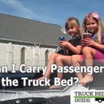 passengers on truck bed